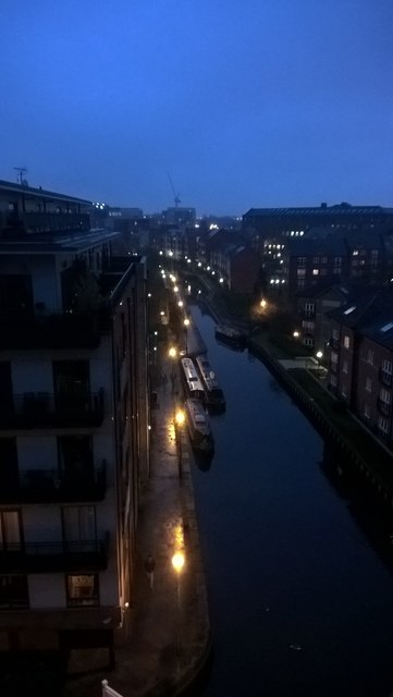 Narrowboats on the Ashton Canal at dusk. Manchester City Centre