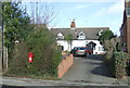 SP2980 : Elizabeth II postbox on Birmingham Road, Allesley by JThomas