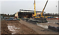 SP3165 : Vitsœ site – a steel frame being lowered into position, Old Warwick Road, Leamington by Robin Stott