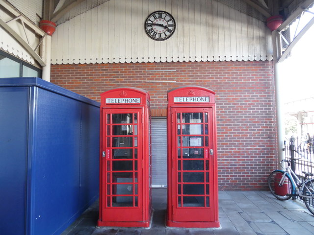 Two Telephone Boxes and a Clock at Windsor & Eton Central Station