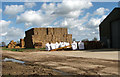 TM0091 : Stack of straw bales by Grange Farm by Evelyn Simak