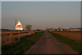 TF4058 : Subsiding road, Bell Water Bank near Hemholme Bridge by Chris