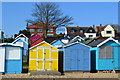 Beach huts and houses above