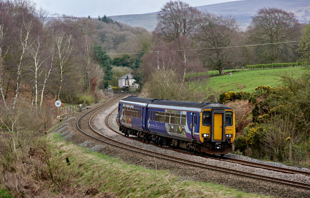 Passenger train approaching site of How Mill station - March 2017
