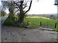 Looking across field from footpath junction with the B2110