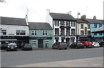 J2053 : Shops on the south side of the Market Square, Dromore by Eric Jones