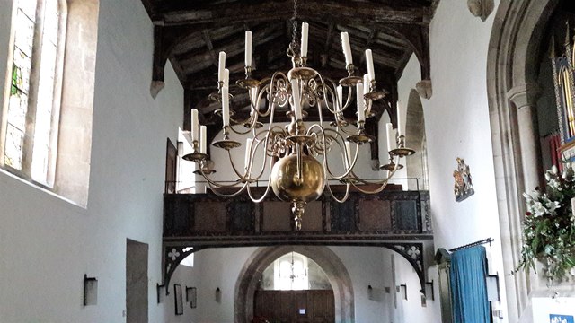 Chandelier and west gallery in All Saints, North Cerney