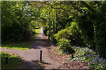 TQ2191 : Path along the side of Woodcroft Park by Christopher Hilton