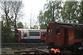 View of a 1992 stock Central line train passing the L11 locomotive #2