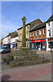 The Market Cross, with High Street shops behind it