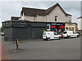 Two white vans parked in Constance Street, Newport