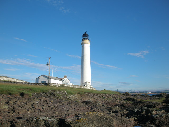 Scurdie Ness Lighthouse viewed from the rocky shore
