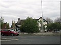 TA2408 : Public  House  sheltering  from  the  roundabout by Martin Dawes