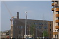 View of a new apartment block next to the Roding from the lock bridge