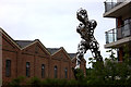 Metal figure on the north side of Bates footbridge