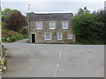 Road junction in Ladock with a house called 