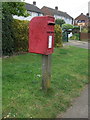 TF6503 : Elizabeth II postbox on Main Road, Crimplesham by JThomas