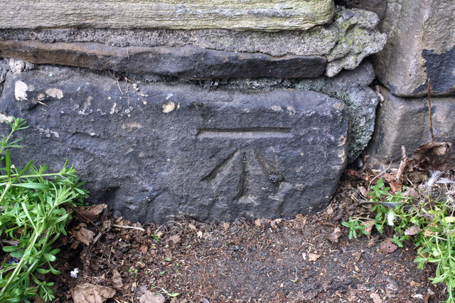 Benchmark on Swinnow Road wall near railway bridge
