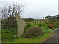 Standing stone beside a cottage