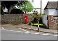 Wallside pillarbox near a thatched cottage, Sidmouth