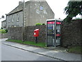 Elizabeth II postbox and telephone box on Main Street, West Witton