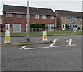 Queens Road pedestrian refuge and road direction signs, Nailsea