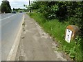 Milestone beside the A4211