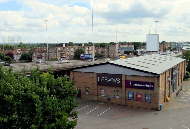 The A3 passes Harveys store in New Malden