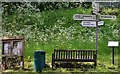 Chedworth: Village notice board and signpost