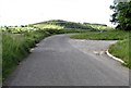 Farm access lane on a bend in Wood Road