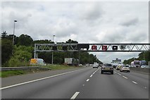 TQ0186 : Gantry over M25 and slip road at junction 16 of M25 by David Smith