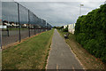 A path between the games courts and the beach