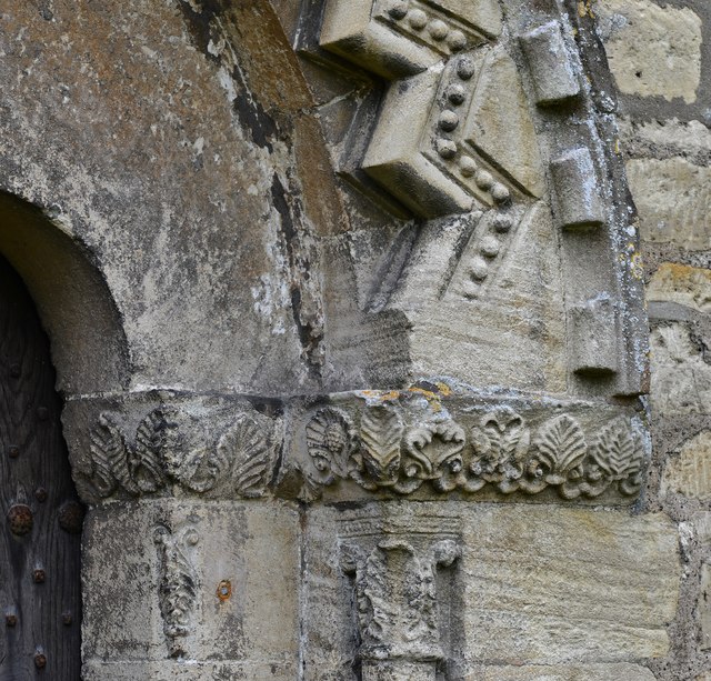 Bibury, St. Mary's Church: The Norman north door with palm leaf design on the capitals