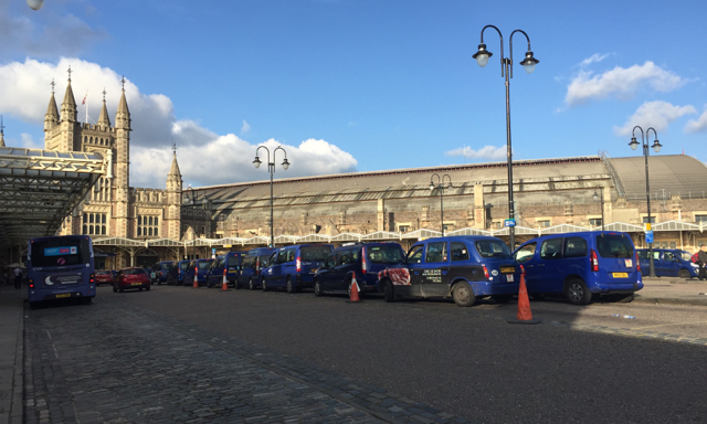 Blue taxis at Temple Meads station, Bristol