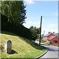 Milestone in the centre of Edington