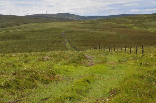 Track by fence and windfarm, Huntly Cot