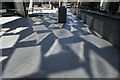 View of stars and rectangles reflected on the ground off the Gherkin #2