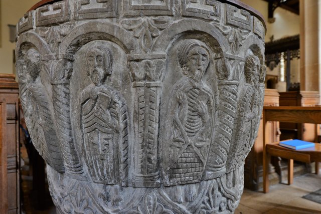 Rendcomb, St. Peter's Church: c12th Norman font, depicting eleven disciples with the tools of their trades 3