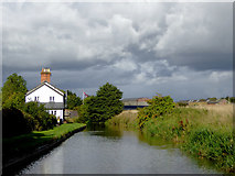 SJ3832 : Canal and cottage near Tetchill in Shropshire by Roger  D Kidd