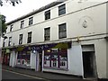 Shops with a crest, Roundstone Street, Trowbridge