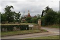 Hall Lane and a tall chimney in Stainby