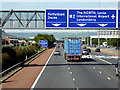 J3476 : Jennymount Footbridge and Sign Gantry over the M2 by David Dixon