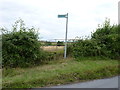 Footpath sign and stile, Grafton Flyford