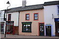 Entrances to yards either side of electrical shop, Middlegate