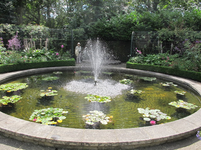 The Holme, fountain in pond with water lilies