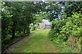 Tree lined driveway to Howmill