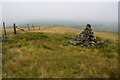 SD7695 : Cairn and fence on Swarth Fell Pike by Roger Templeman