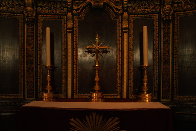 View of a cross and two candles at the rear of the altar in St. Paul's Cathedral