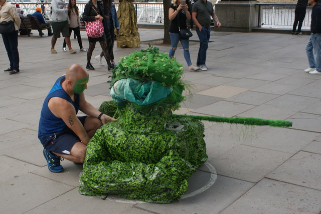 View of a green tank street entertainer on the South Bank
