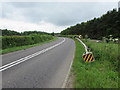 ST9998 : Roadside barrier at a bend in the road near Kemble by Jaggery